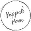 The words Happah Home in grey in a grey sketched circle